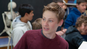 teenage boy in science class at Waldorf School of the Peninsula