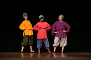 three actors take the stage in renaissance garb