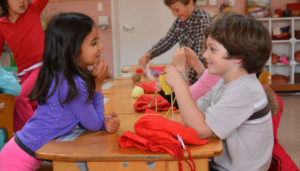 first graders participating in handwork