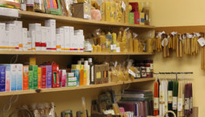 shelves of the waldorf school gift shop with various items for purchase