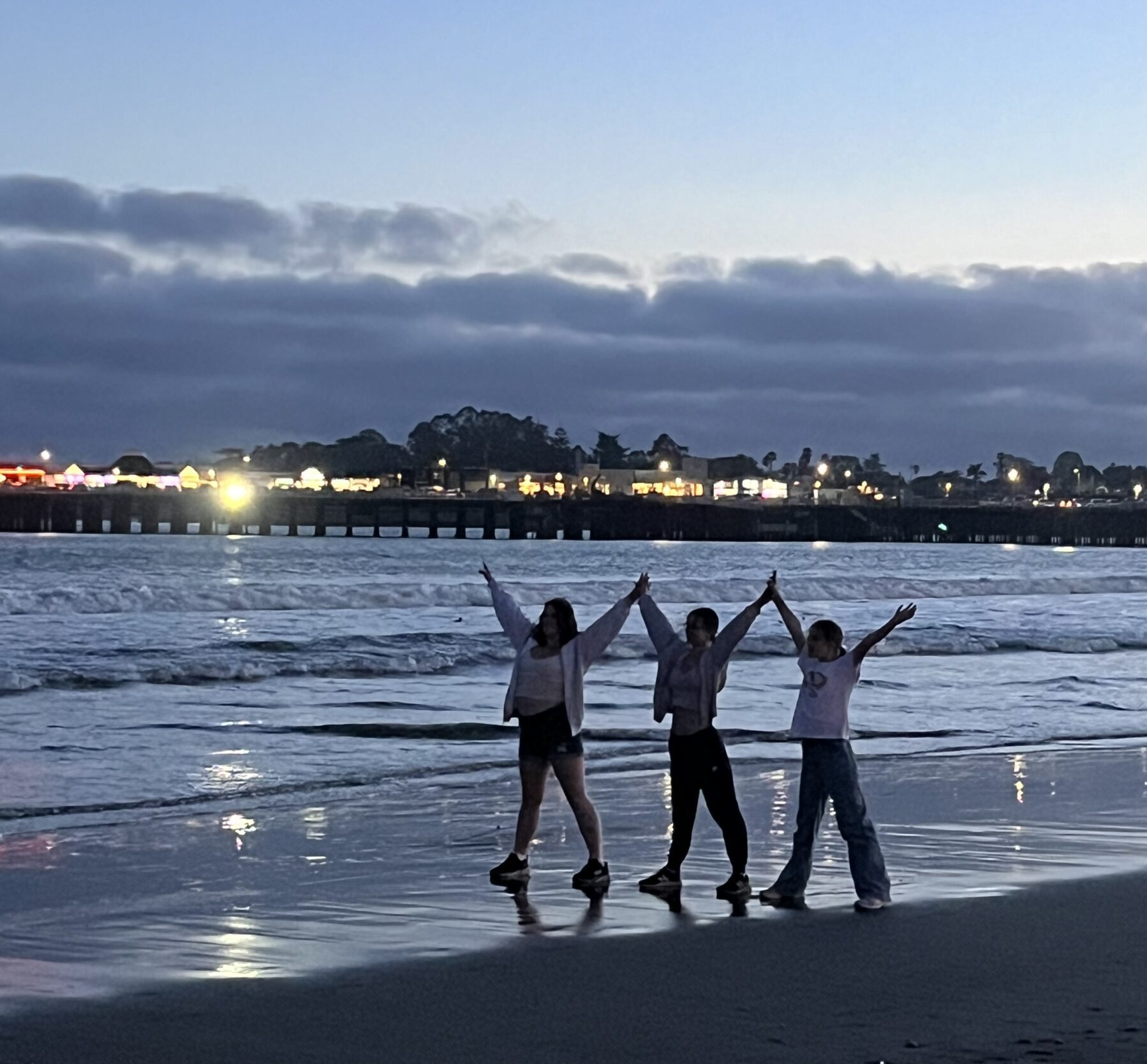 Three students enjoying the beach in Santa Cruz